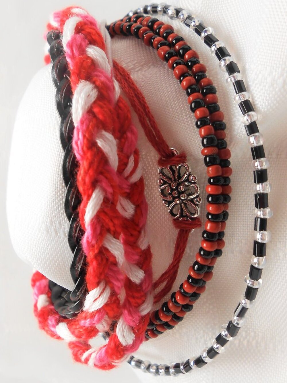 Handmade bracelet with rows of threads, beads, and charms No. 236